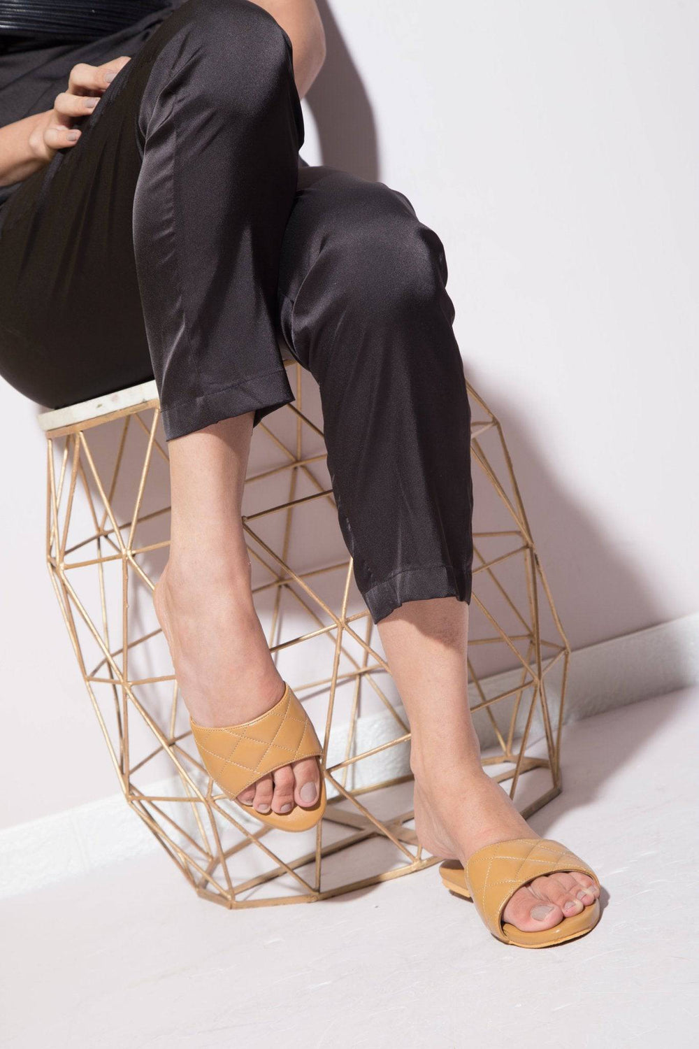 Beige Windlust Super Cushioned Quilted Flats showing a close-up of the padded, quilted fabric and slip-on style.