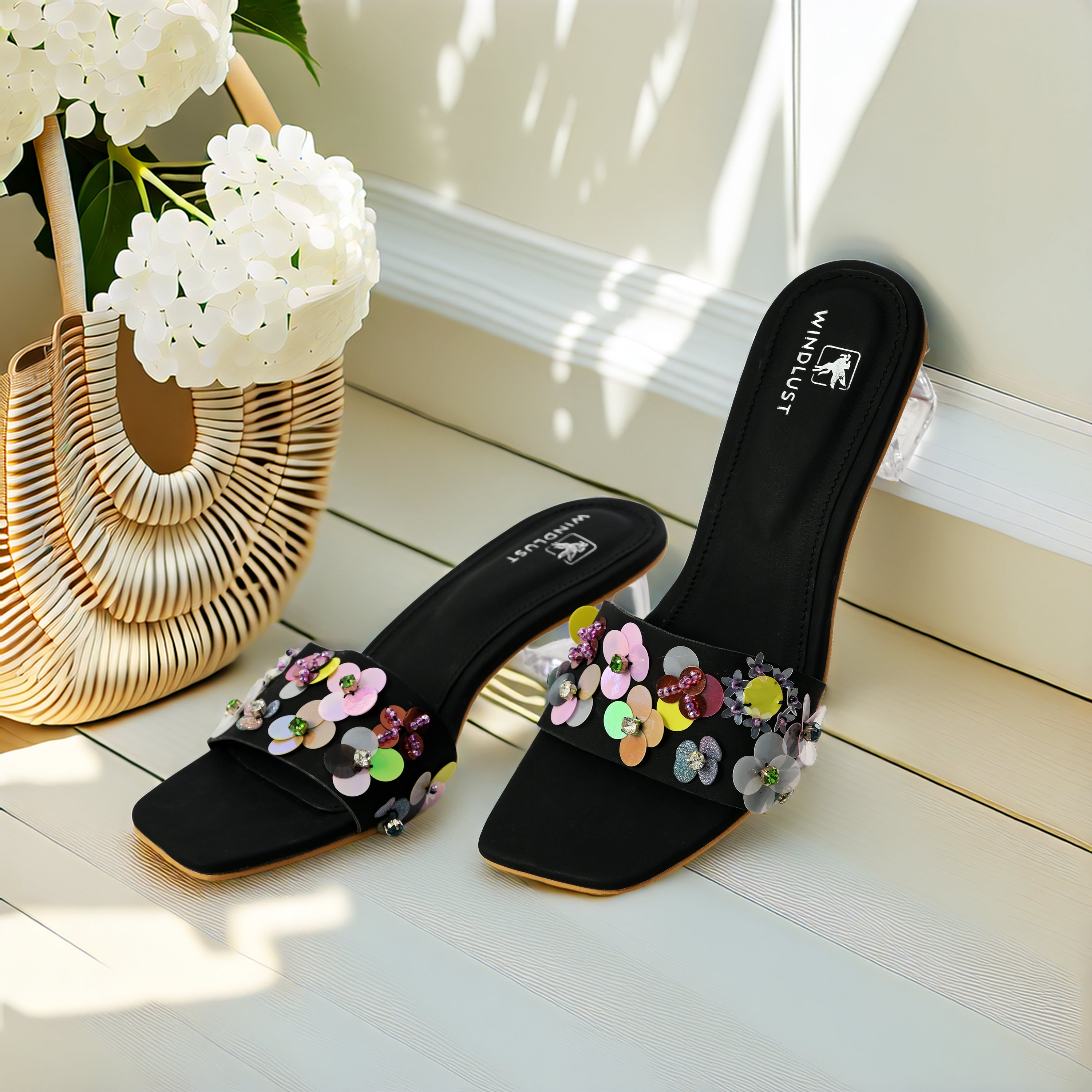 Black Windlust luxury heels with hand-embellished details, elegant high-heeled footwear for formal occasions.