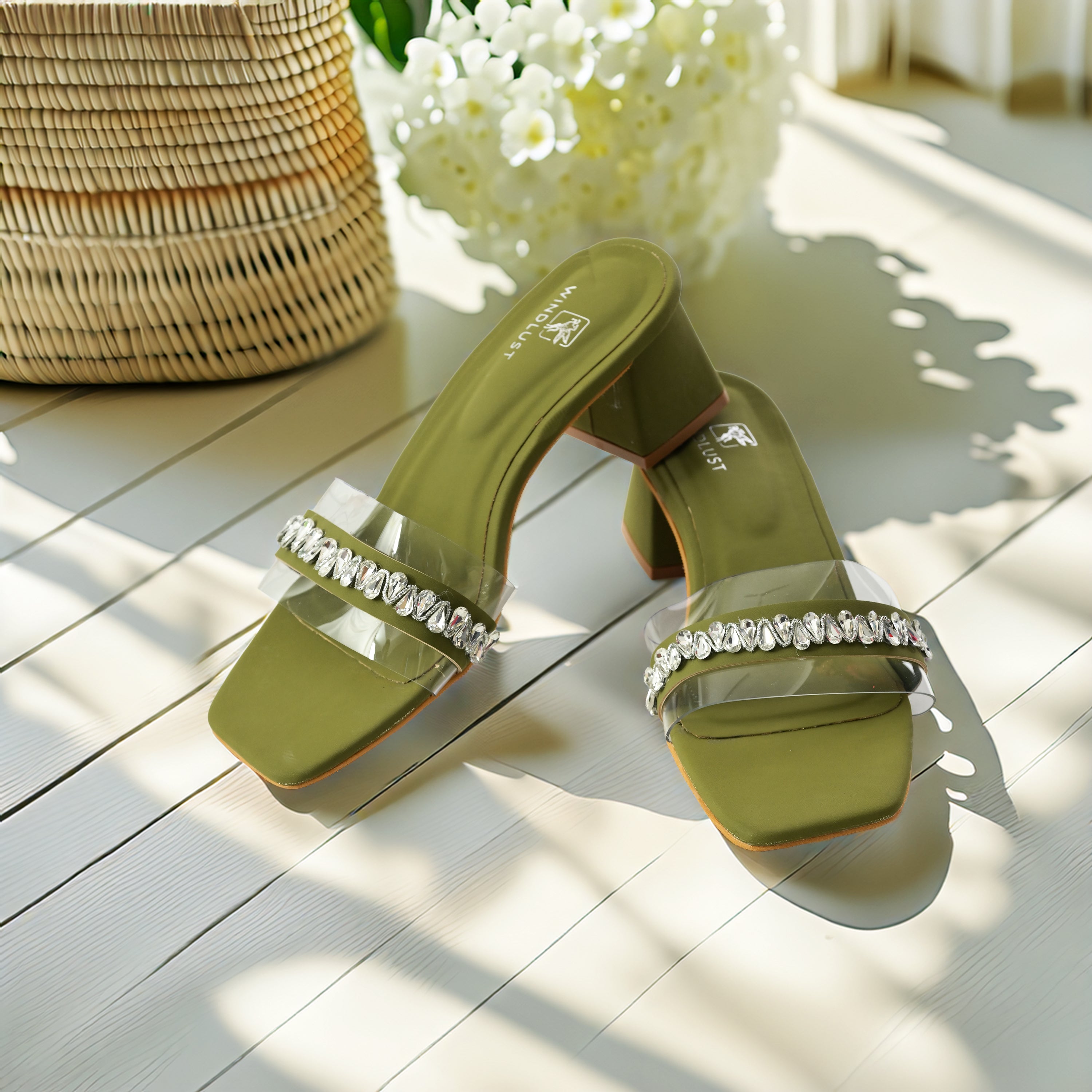 Windlust clear heels with Swarovski embellishments and deep green accents, stylish open-toe footwear for women.