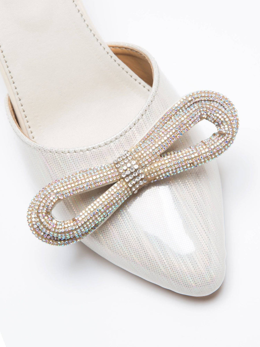 Windlust metallic cream embellished bow heels featuring a stylish design with decorative details and a sleek heel silhouette.