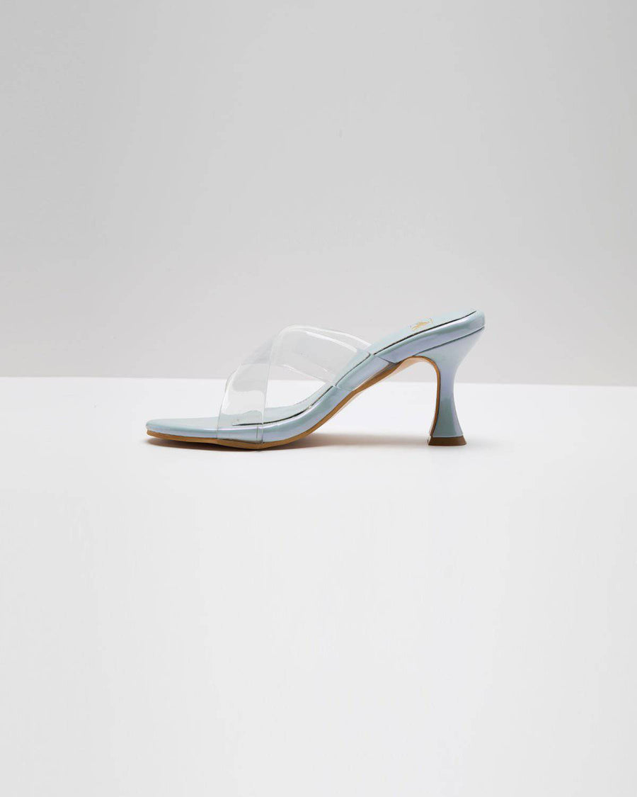 Light metallic blue transparent cross-strapped pumps by Windlust, stylish high heels with a sleek design.