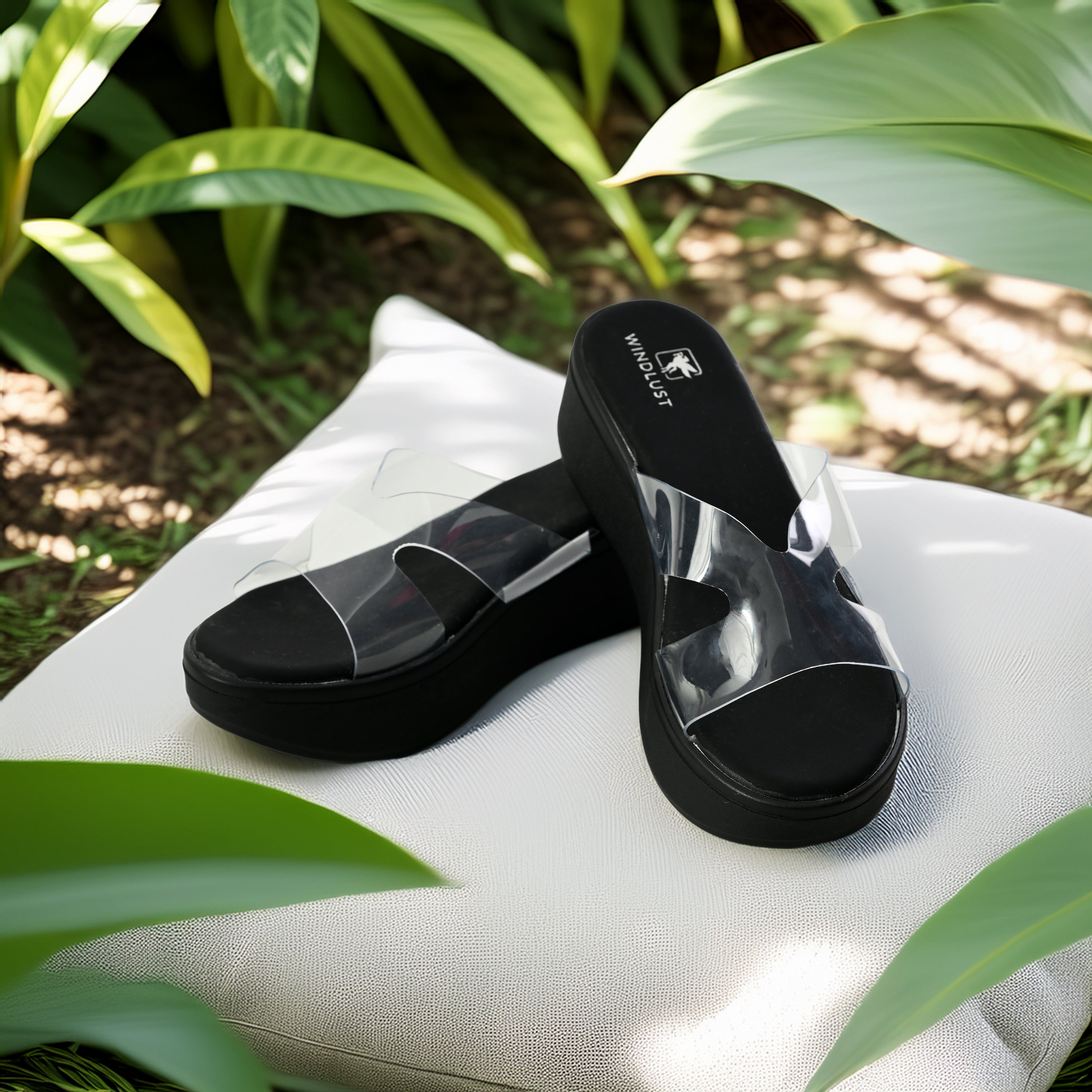 Black Clear X-Flow Wedge by Windlust with transparent design and comfortable wedge heel for stylish support.