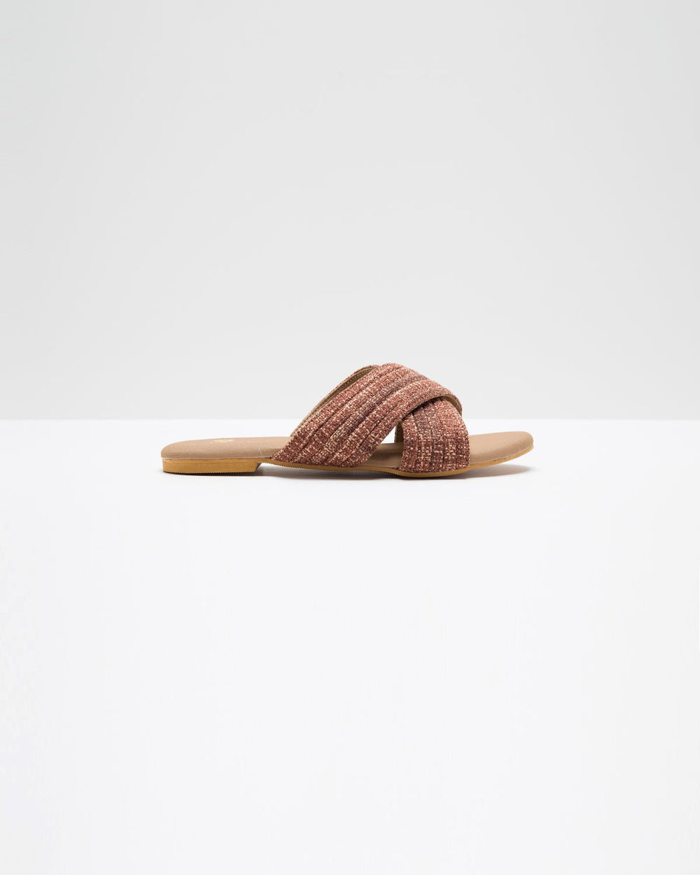 Windlust cross-strapped beige and wine jute flats with woven design and open toe, perfect for casual summer wear.