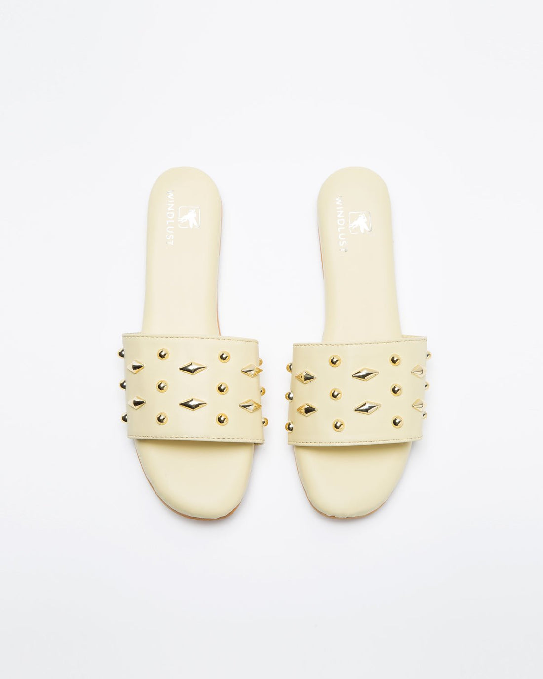 Yellow Windlust flats with sleek design and studded accents, featuring comfortable slip-on style for casual wear.