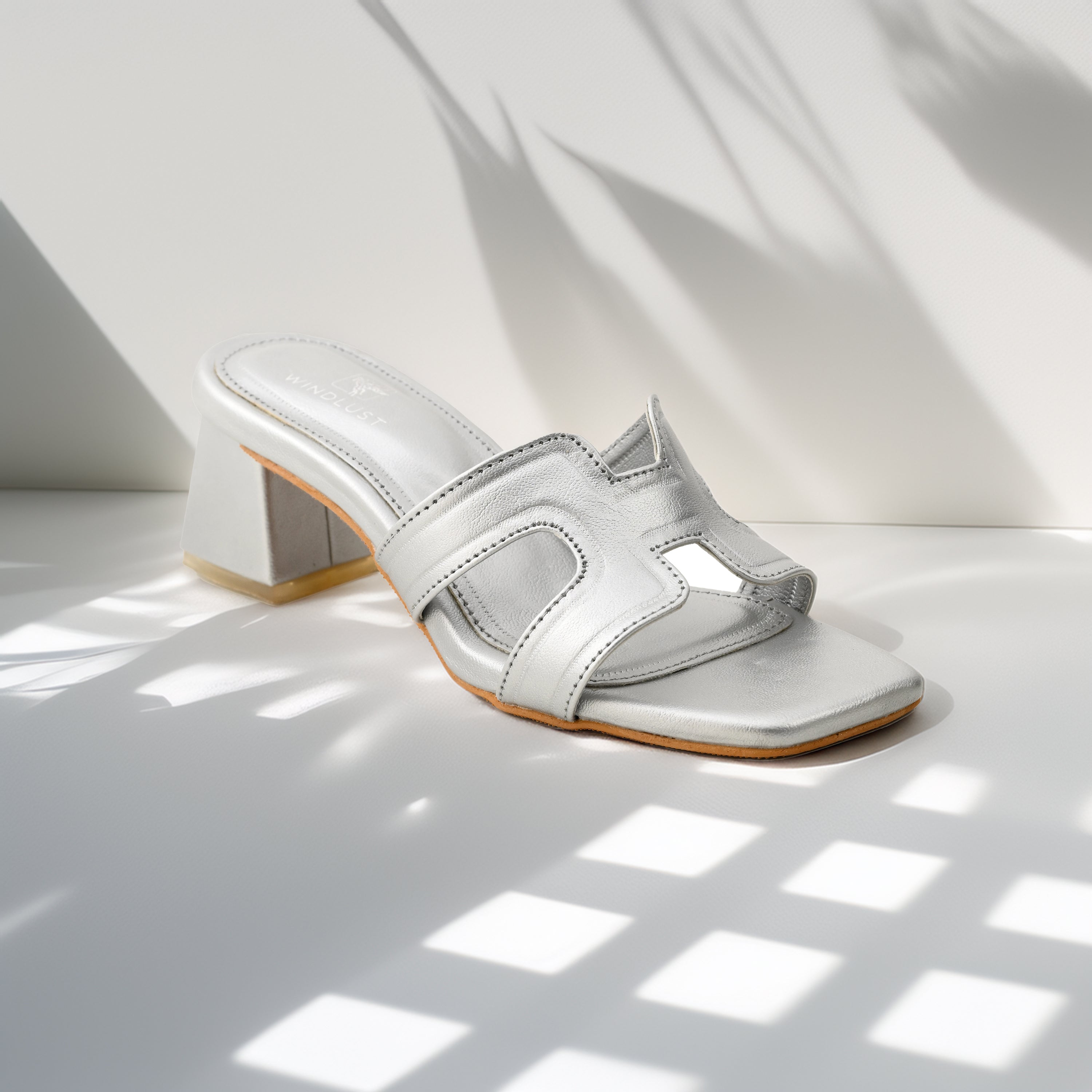 Windlust 4 Way Cut Solid Heels in matte silver, stylish high heels with a unique cut design and sleek finish.