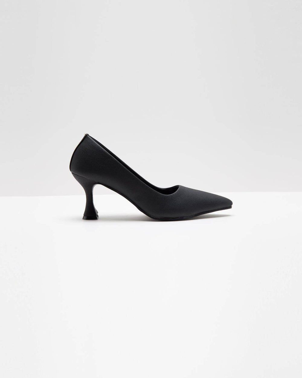 Black matte stiletto heels by Windlust, sleek and stylish with pointed toes, perfect for elegant outfits.