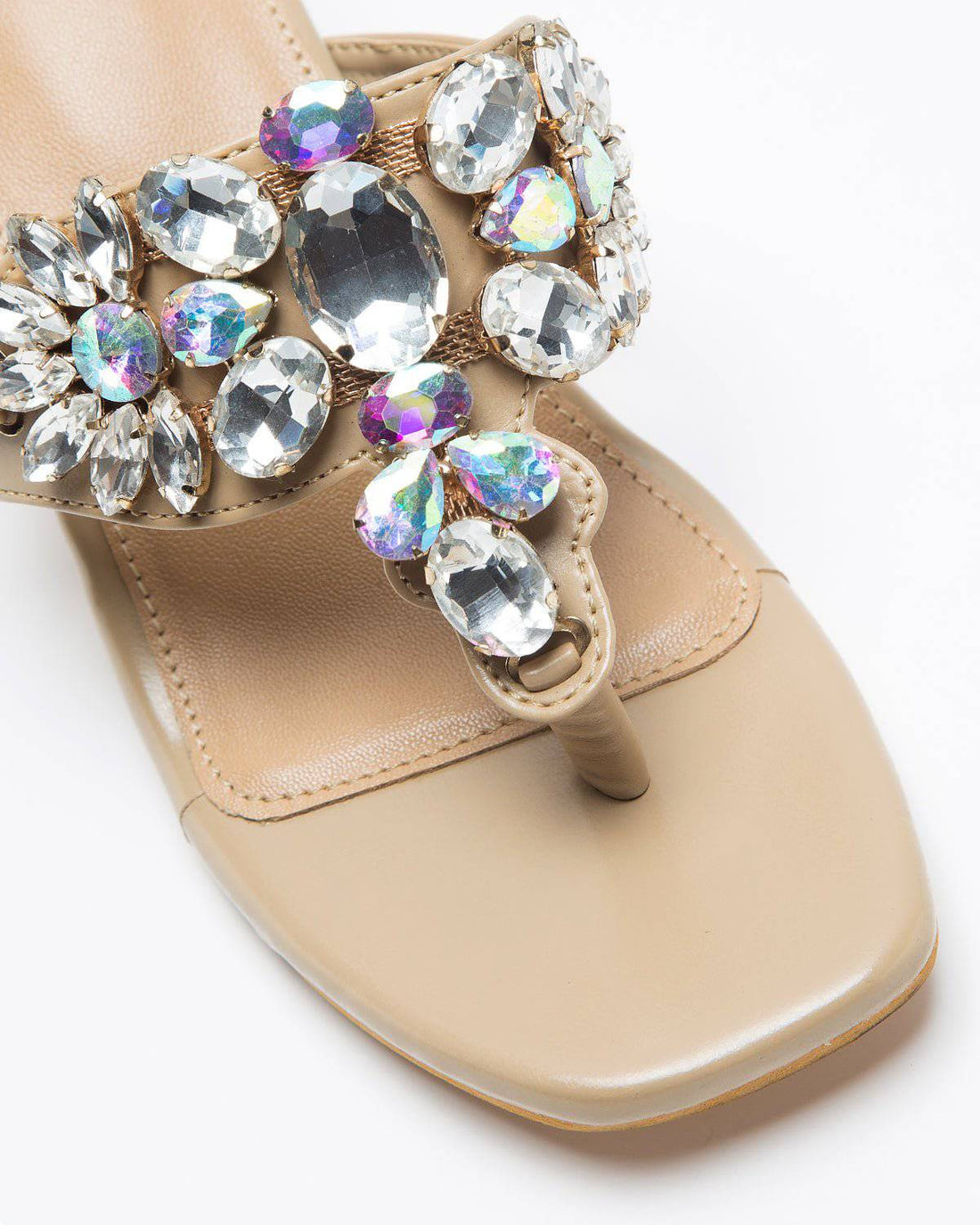 Nude shade Kohlapuri stone-embellished heels by Windlust, showcasing traditional Indian footwear with intricate detailing.