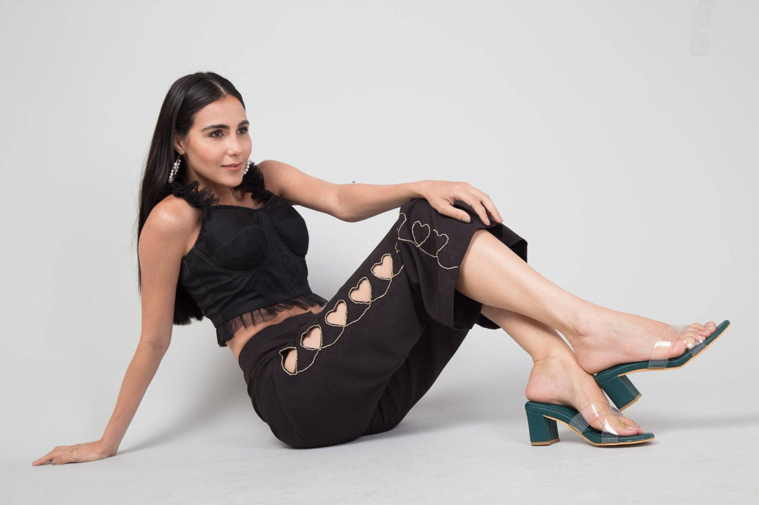 Emerald green transparent cross-strapped heels by Windlust, stylish open-toe heels with a sleek design and stiletto heel.