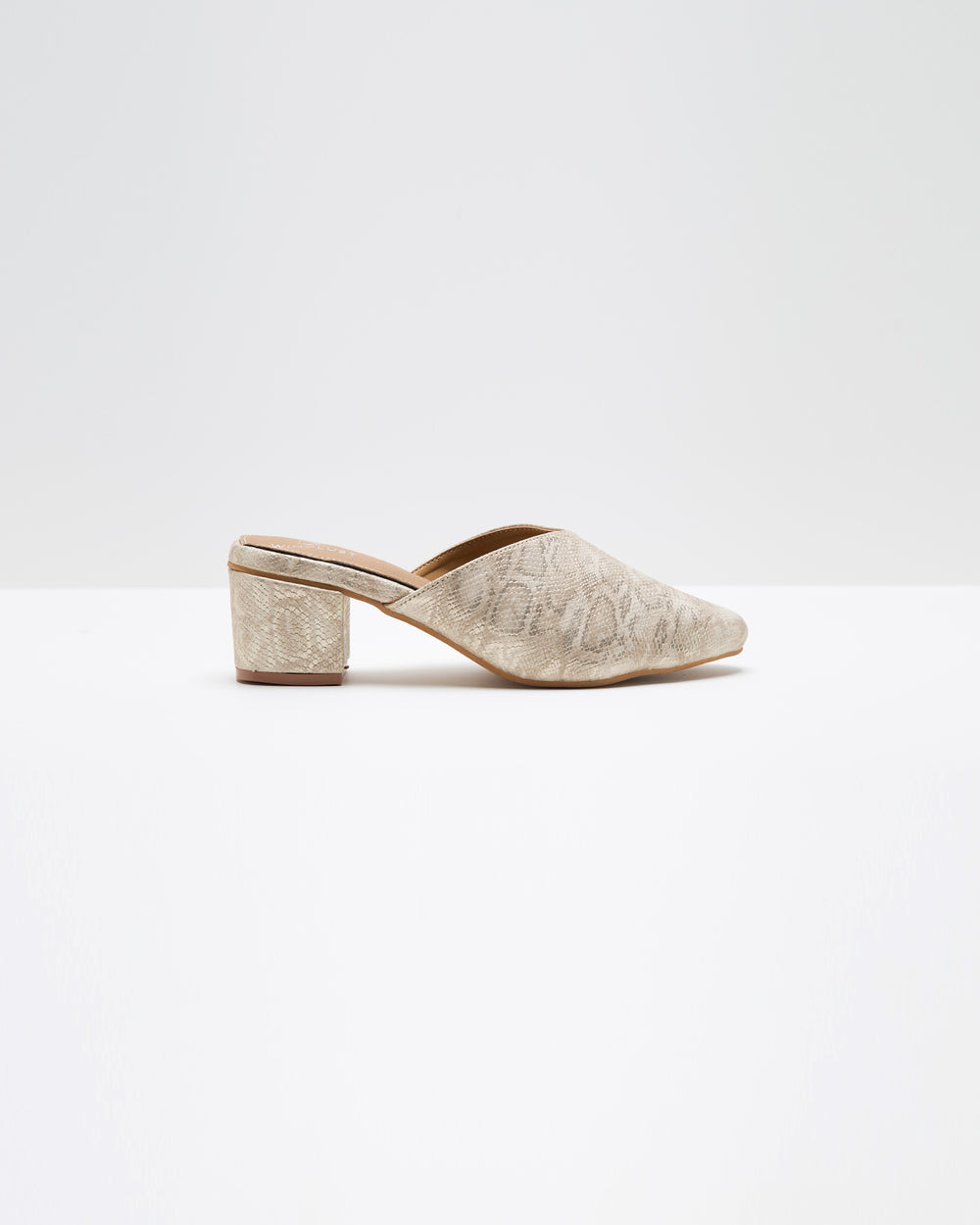 Windlust Annaconda Pattern Mules showing beige and brown snake print design with pointed toes and slip-on style.