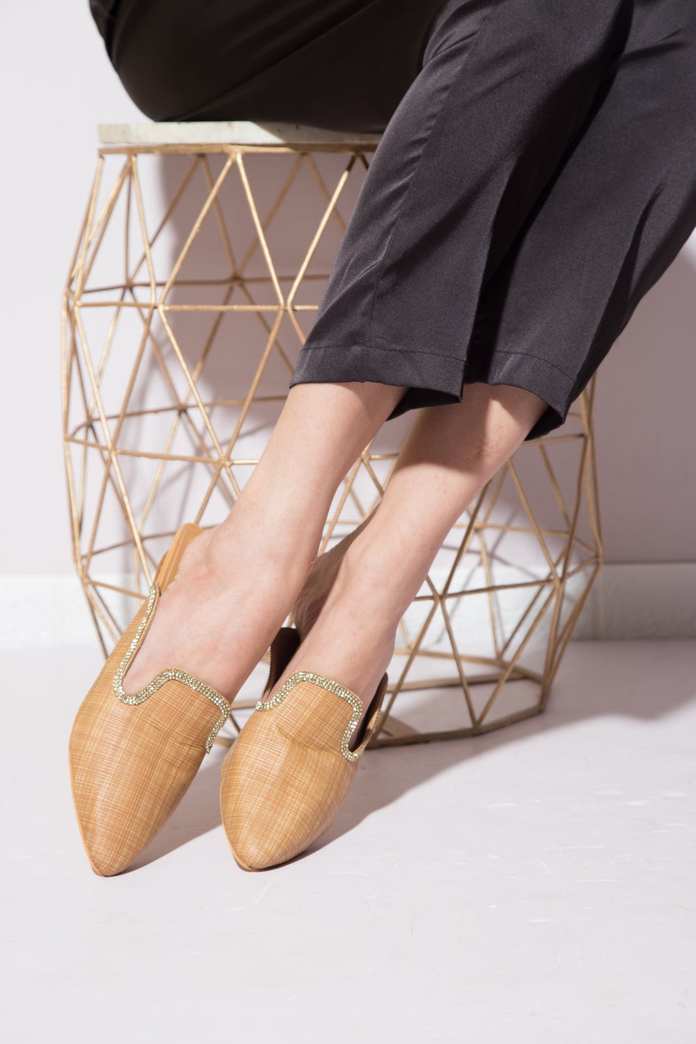 Fine textured beige Windlust mules with a sleek design, showcasing a stylish and comfortable slip-on footwear option.