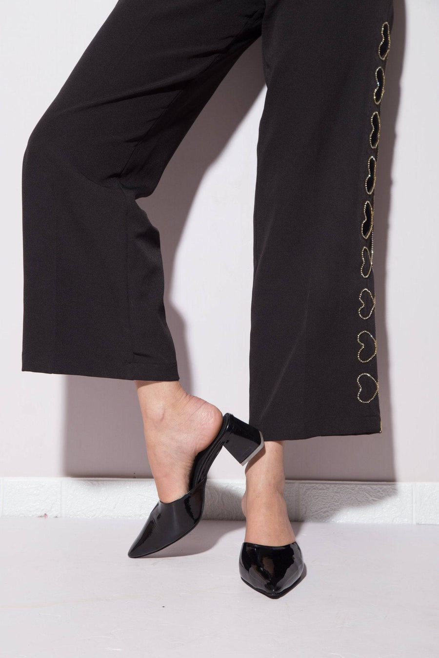 Solid black Windlust mule shoe featuring a sleek design, perfect for casual or dressy wear.
