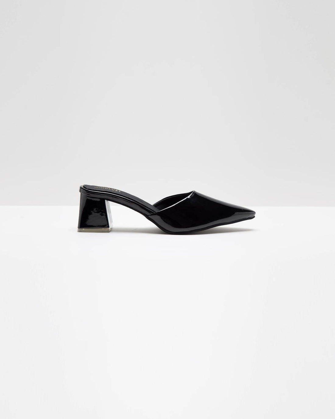 Solid black Windlust mule shoes with a sleek design, featuring a comfortable slip-on style and a pointed toe.