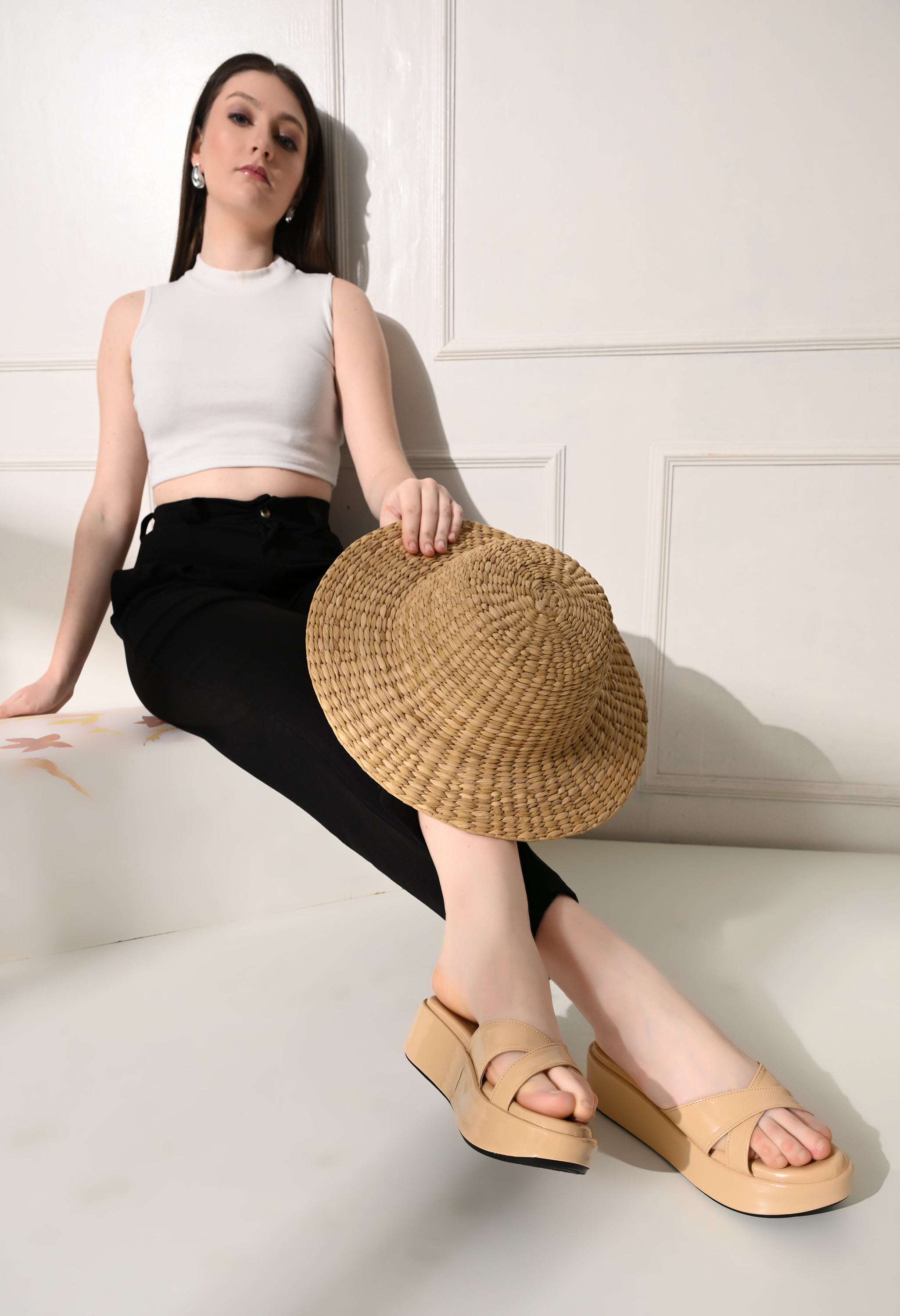 Beige Windlust cross strap wedges with chunky heel, open toe design and ankle strap for a stylish summer look.